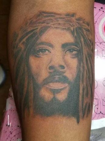 Zwarte Jezus tatoeage