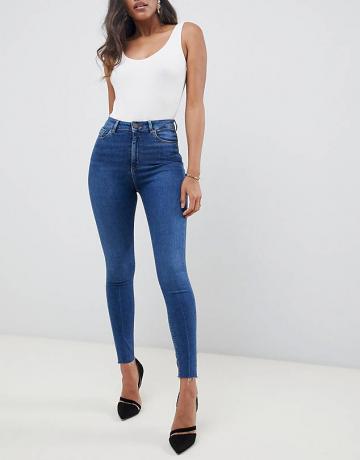 Asos Design Ridley jeans skinny de cintura alta em pedra escura lavada com detalhes de bainha crua