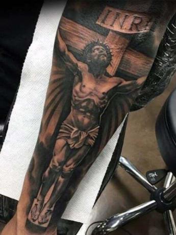 Jezus onderarm tatoeage