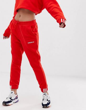 Teplé nohavice Adidas Originals Coeeze v červenej farbe
