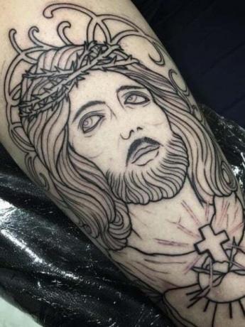 Jėzaus trafareto tatuiruotė