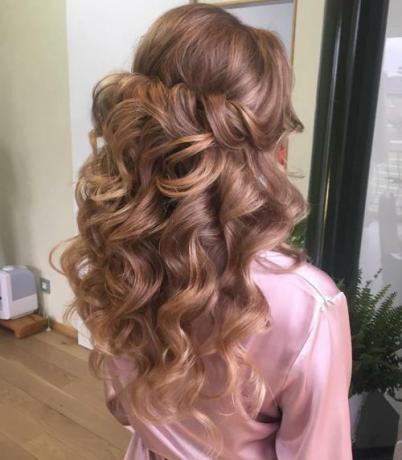 Voluminous Curly Half Updo With A Bouffant
